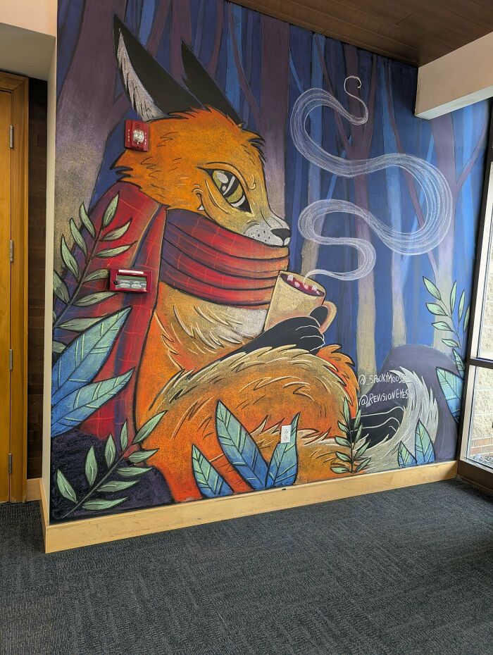 Mural of a fox holding a steaming mug, surrounded by leaves, showcasing creative DIY wins in an indoor space.