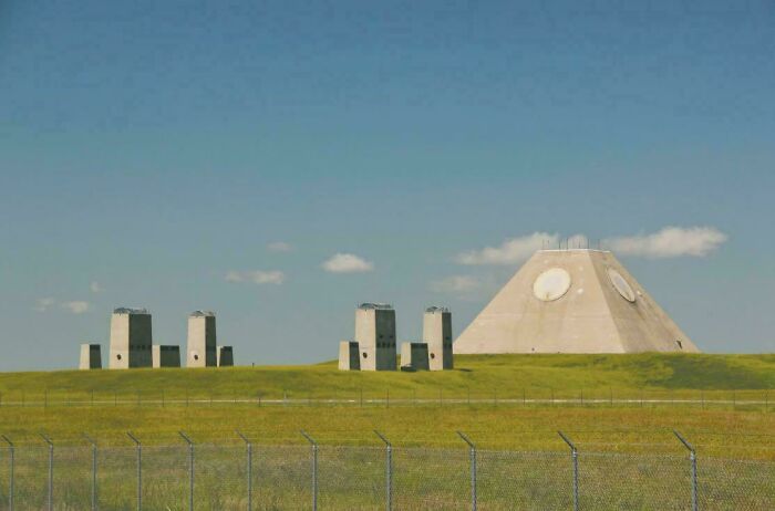 A pyramid-shaped building and several block-like structures, ideal for an evil mastermind to plan world domination.