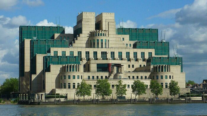 A fortress-like building with tiered architecture, possibly built for an evil mastermind, beside a river.