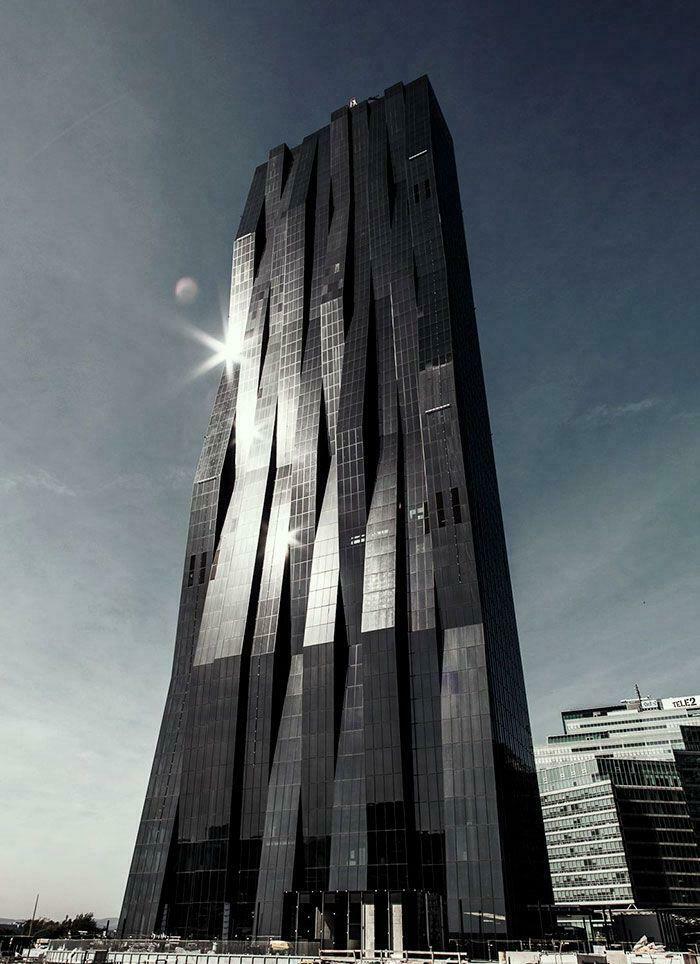 Skyscraper with a unique, angular design reflecting the sun, a contemporary evil mastermind building to conquer the world.