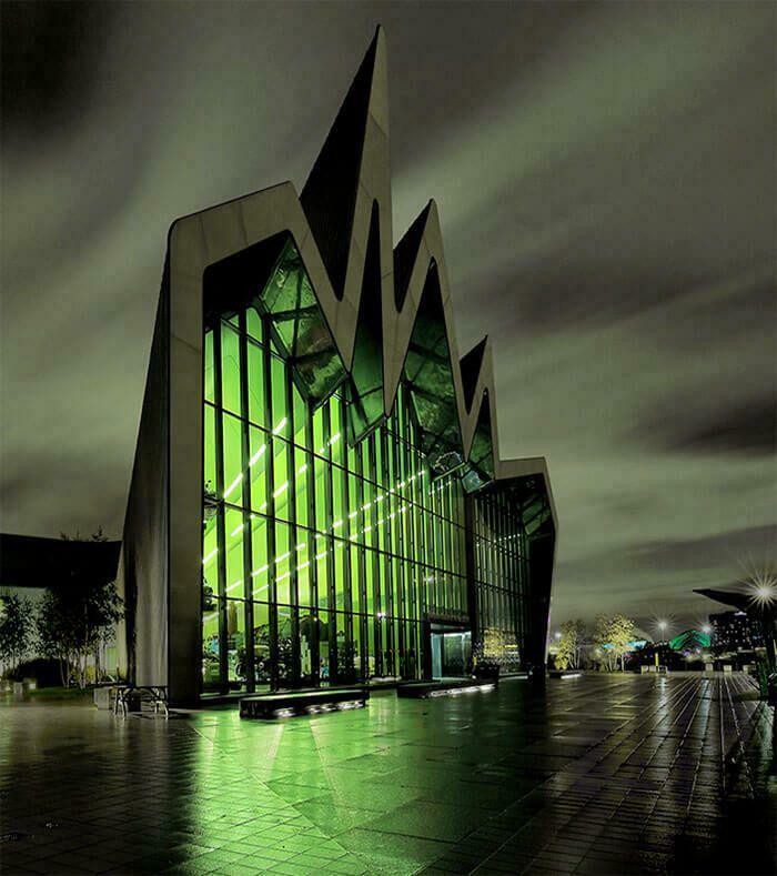 Modern building with jagged peaks and glowing green interior, suggesting a base for an evil mastermind to conquer the world.