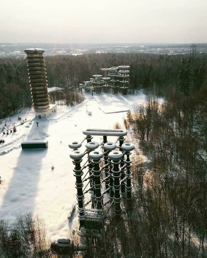 An aerial view of unusual, large buildings in a snowy landscape, perfect for an evil mastermind's plans.