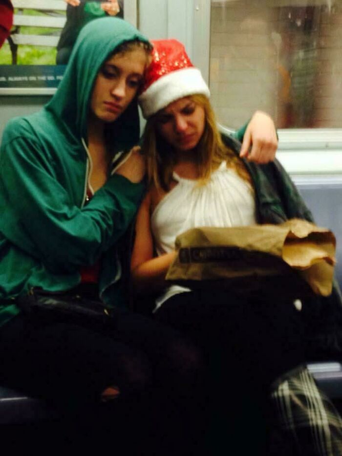 On The Subway As Santacon Was Wrapping Up A Few Years Back. One Girl Comforts Another As She Cries Over A Burrito