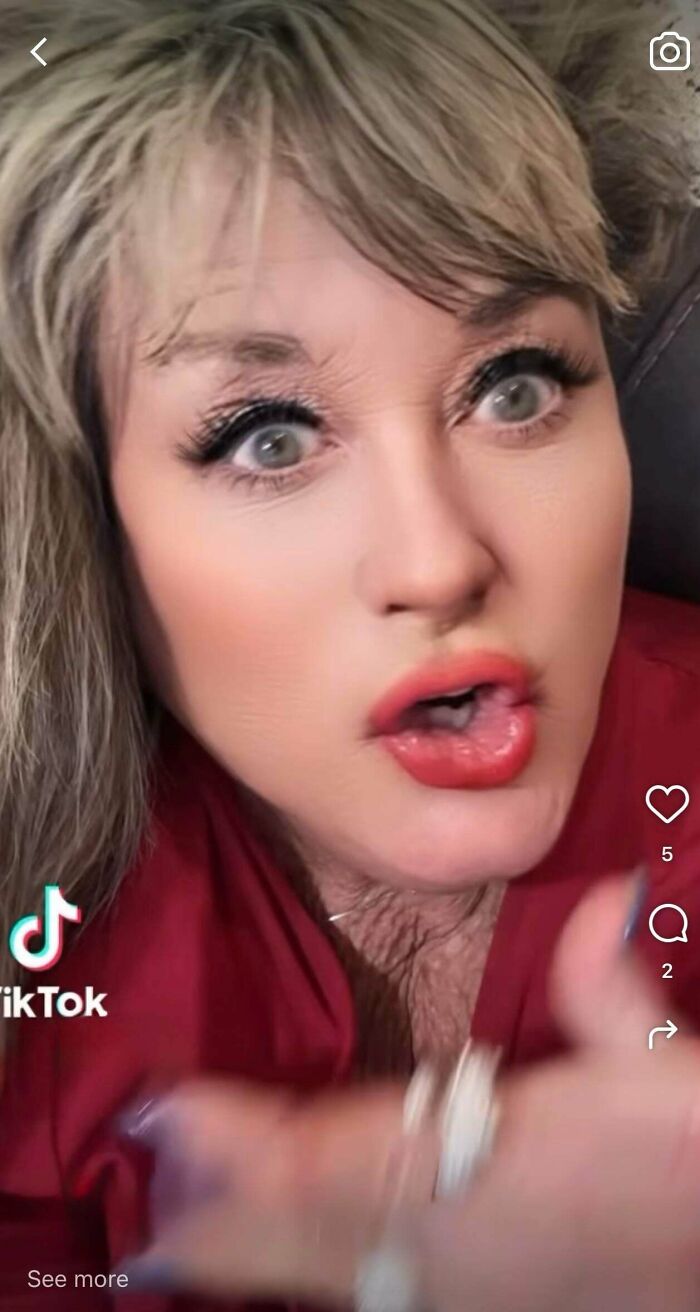 A woman on social media with wide eyes and open mouth, not trying to look natural, possibly a joke.