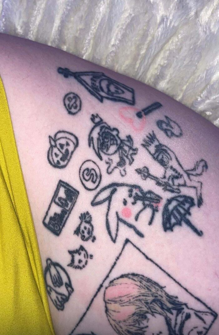 Collection of small, odd tattoos on upper arm showing questionable designs proving bad tattoos and thinking first optional.