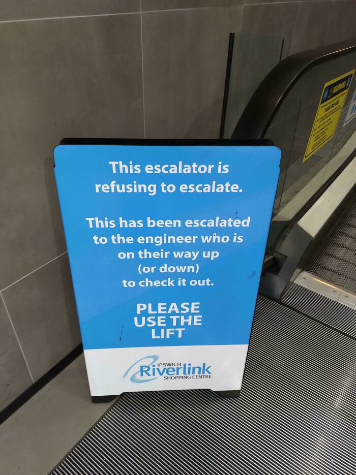 Funny and bizarre sign at an escalator explaining it is not working and asking people to use the lift instead