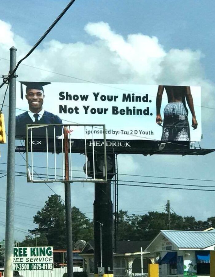 Humorous sign showing a graduate and a message about showing your mind, part of bizarre and hilarious signs collection.