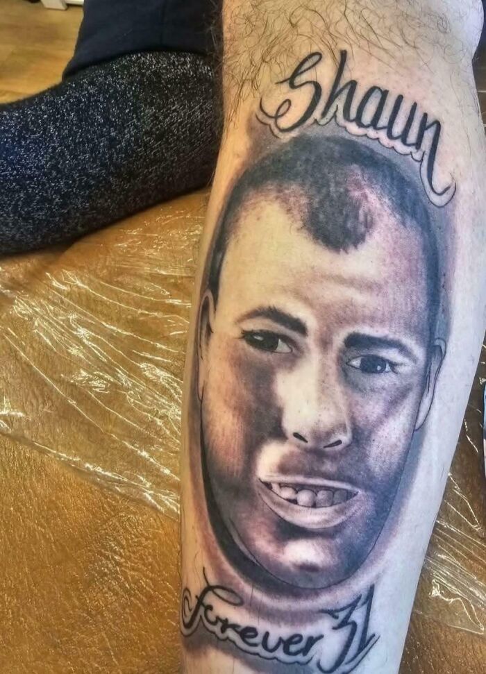 Tattoo of a distorted male face with the words Shaun and forever 31 showcasing bad tattoos with poor design and e*******n.