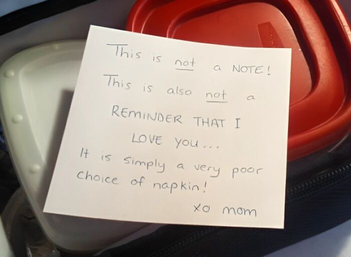 Handwritten amusing note from a parent on a napkin, showing creativity and humor in everyday family communication.