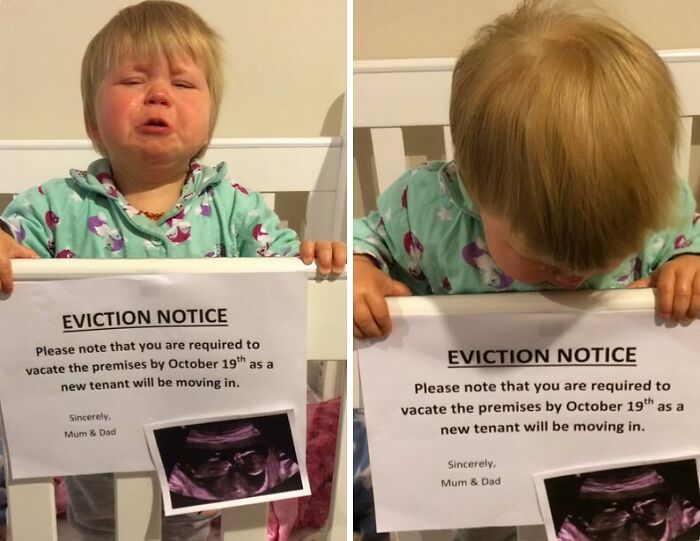 Toddler holding an amusing eviction notice note from parents with a sonogram picture, showcasing creative and funny parenting notes.
