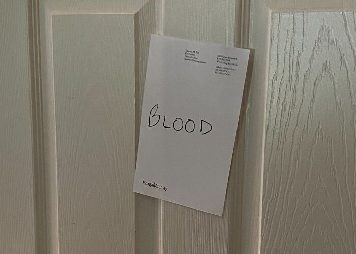Note with the word blood humorously left by parents on a door as a creative and amusing note example.