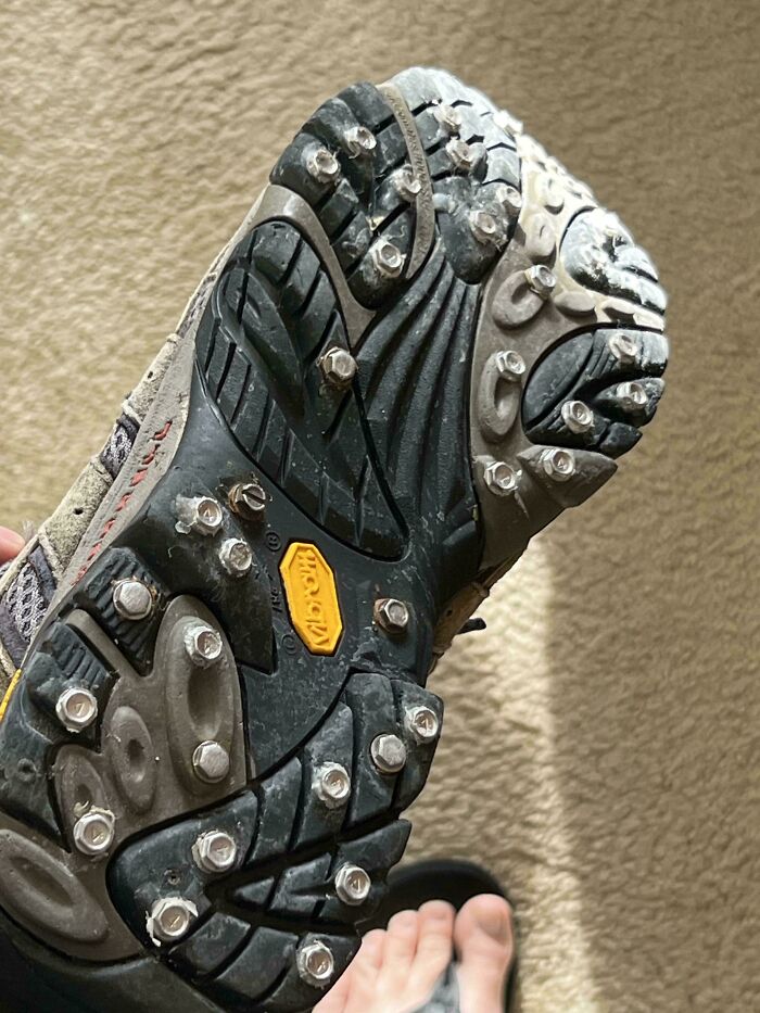 Shoe sole modified with bolts for extra grip, an example of redneck engineering that might worry actual engineers.