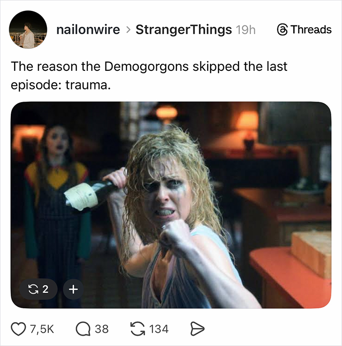 A distressed woman with wet hair holding a bottle aggressively in a dimly lit room from Stranger Things finale scene.