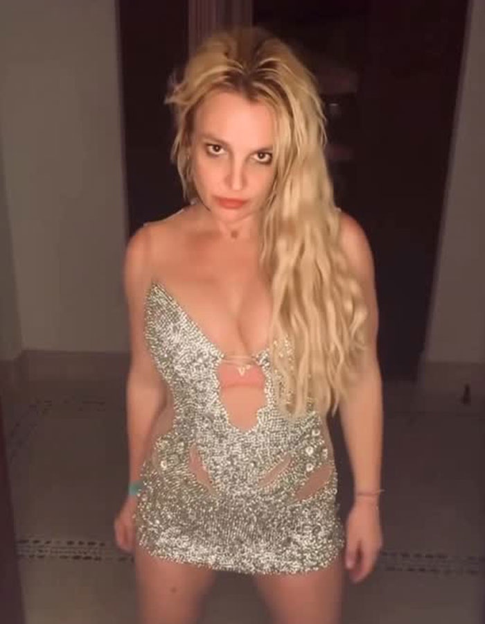Britney Spears in a sparkling dress facing backlash after saying she will never perform in the U.S. again.