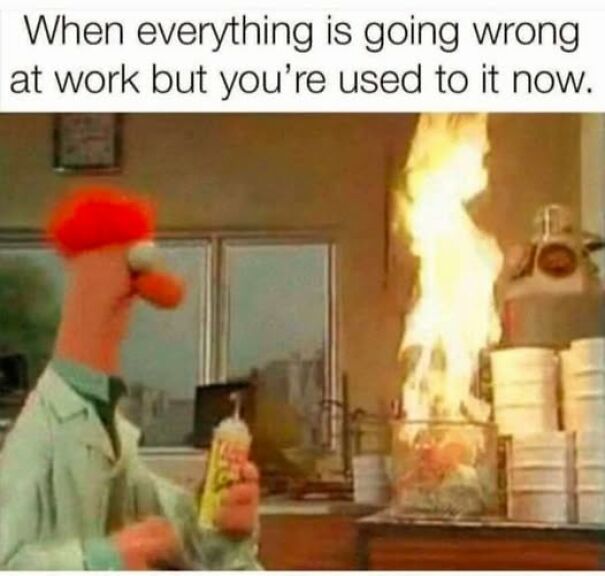 Beaker from Muppets in a lab with fire accidents, illustrating relatable memes about chaotic work situations.