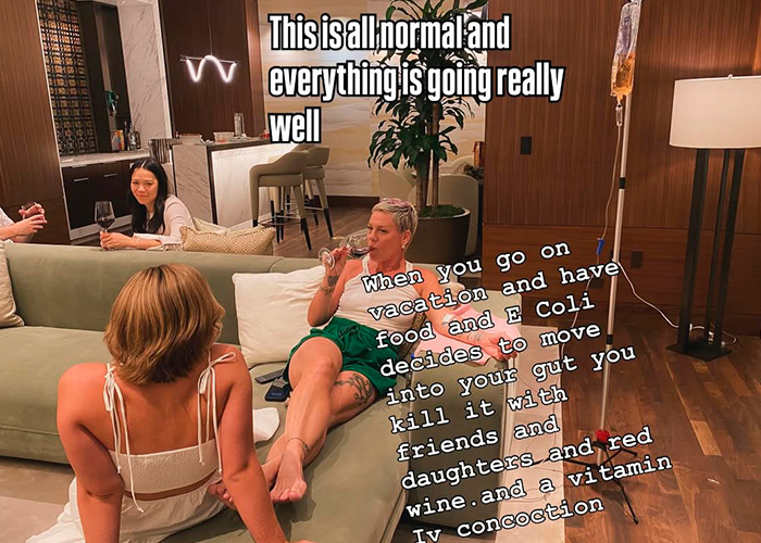 Pink relaxing with friends and drinking wine at home after spending New Year&rsquo;s Eve alone in hospital receiving IV treatment.