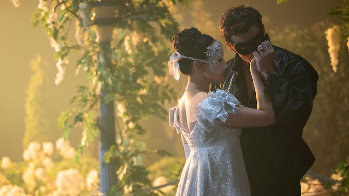 Couple wearing elegant masks in a romantic dance scene, highlighting TV show release dates in February 2026. Couple wearing elegant masks in a romantic dance scene, highlighting TV show release dates in February 2026.