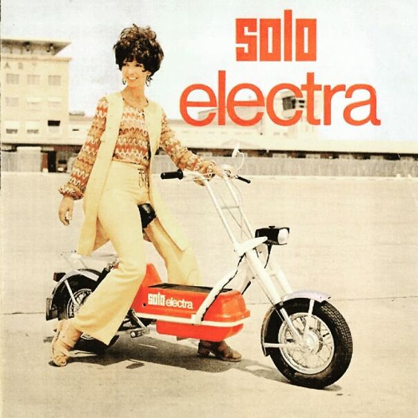 Woman in vintage ad posing with a Solo Electra electric bike reflecting values changed and stayed over time.