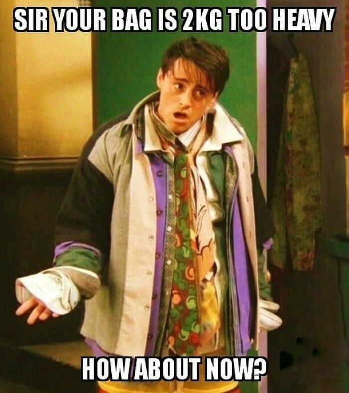 Man overloaded with clothes to avoid baggage fees in a funny travel meme about expensive travel and packing limits.