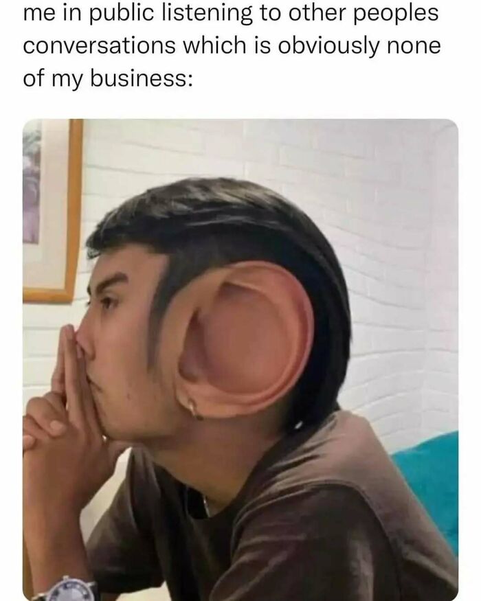 Person with exaggerated large ear listening intently, illustrating relatable memes about life as an introvert.