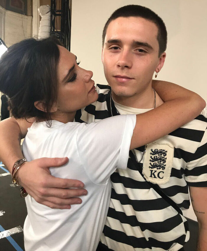 Two people embracing closely, with one looking at the other, representing DJ at Brooklyn Beckham's wedding dance accusations response.