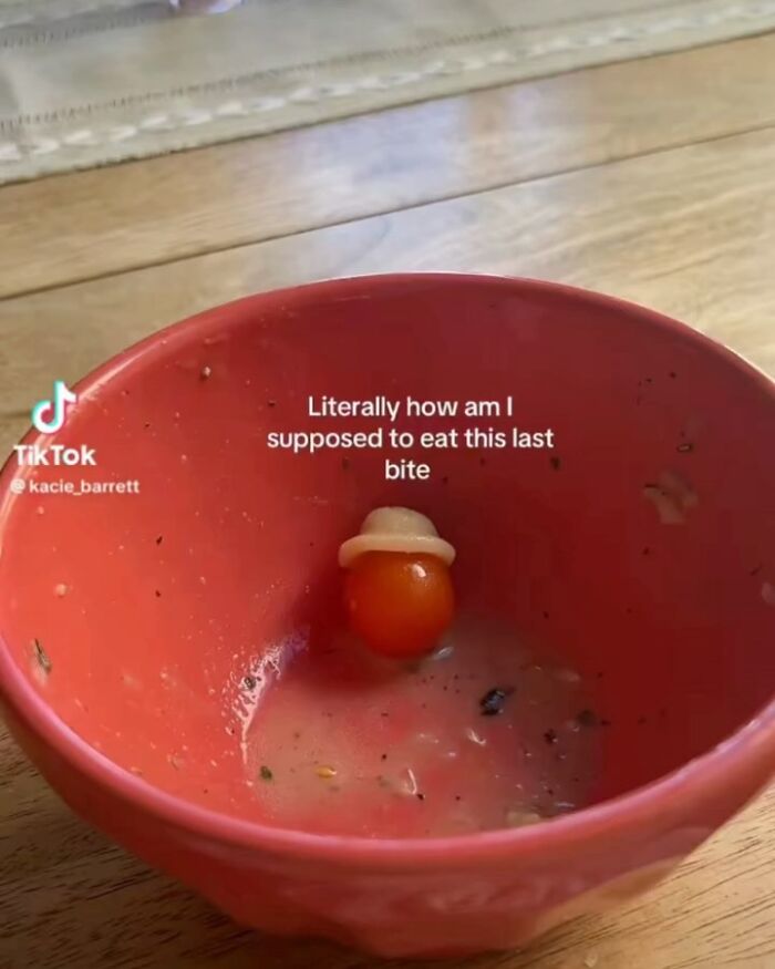 Cherry tomato with a tiny hat stuck at the bottom of a bowl, illustrating a funny screenshot people took moment.
