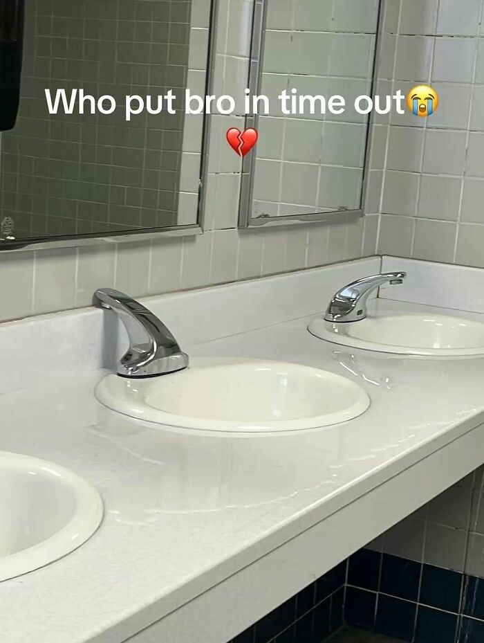 Bathroom sinks with one faucet stuck in the down position, a funny screenshot capturing a restroom fail moment.