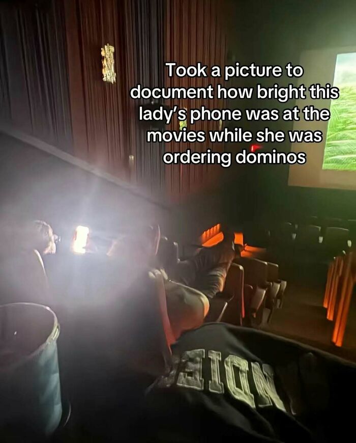 Bright phone screen at the movies disturbing others as person orders Domino's, captured in one of the funniest screenshots.