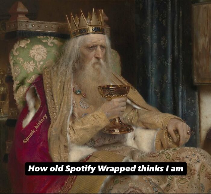 Classical art meme of a medieval king holding a goblet, humorously captioned about Spotify Wrapped age perception.