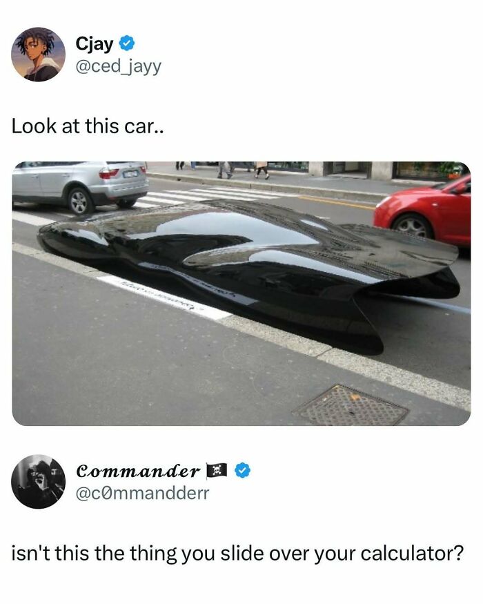 Sleek black futuristic car parked on street with humorous meme caption to fight boredom and entertain viewers.