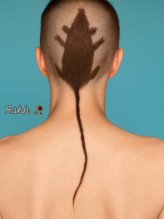 Unique hairstyle featuring a rat-shaped design shaved and styled on the back of a person's head, fitting bizarre memes theme.