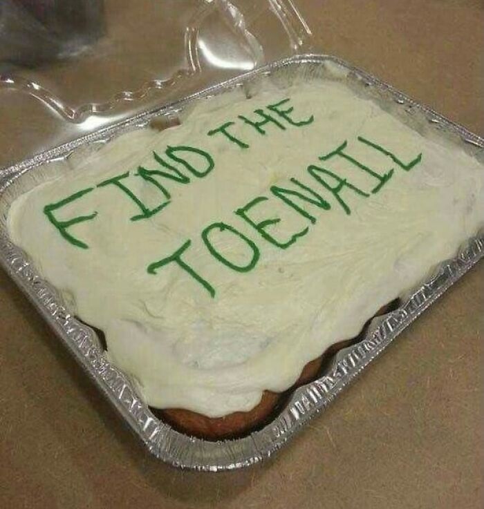 Cake with white frosting has green writing saying find the toenail, a bizarre meme that might leave you puzzled.
