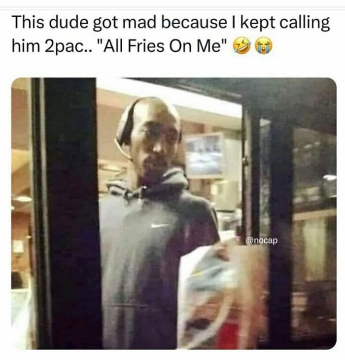 Man at a drive-thru window looking annoyed while holding a food bag in a random memes funny moment.