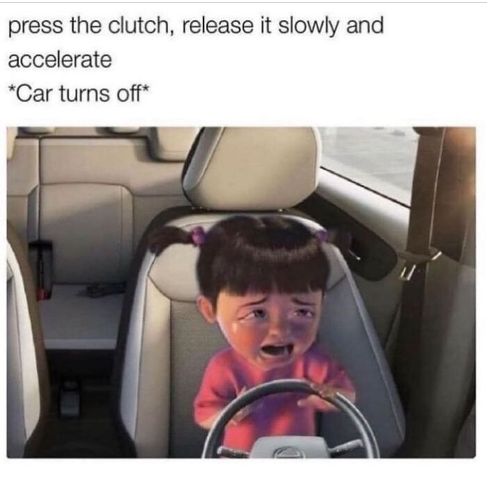 Toddler struggling to drive a car in a funny random meme highlighting unexpected driving fails.