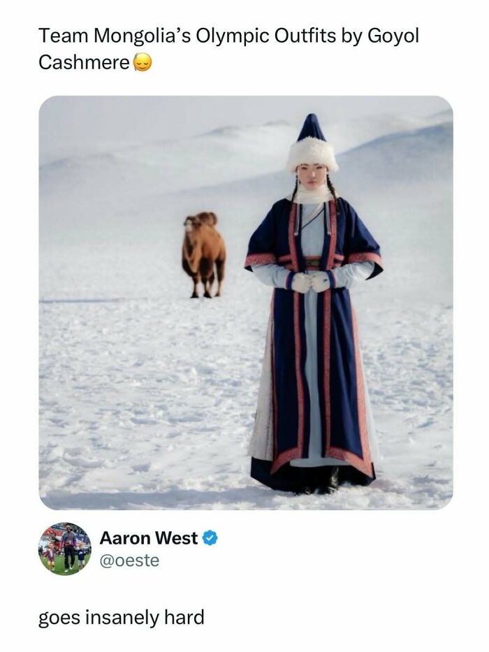 Person in traditional Team Mongolia Olympic outfit standing in snowy landscape with camel in the background for entertaining posts and memes.