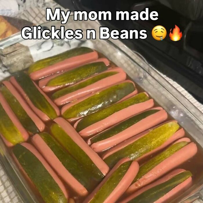 A dish of bizarre glickles n beans with hot dogs and pickles in liquid, illustrating random and bizarre memes.