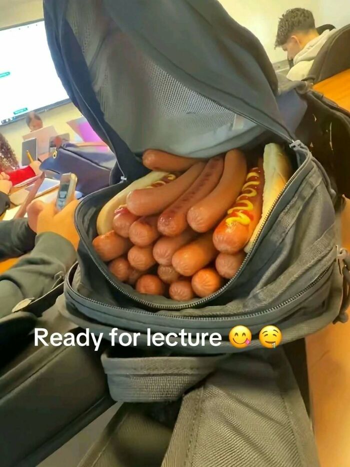 Backpack filled with hot dogs, some with mustard, captioned ready for lecture in a random and bizarre meme setting.