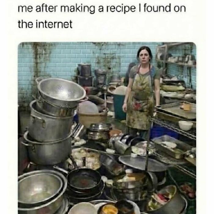 Woman standing overwhelmed in a cluttered kitchen with dirty pots and pans, funny memes about avoiding chores.