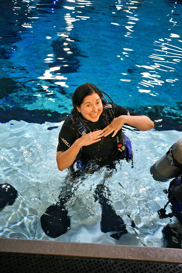 Woman in scuba gear in a pool in Central Florida, experiencing the beauty and real emotion of the calm water.
