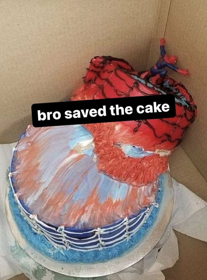 Funny screenshot of a Spider-Man cake with a figure saving the top, showing a humorous cake fail moment.