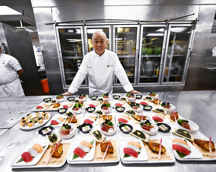 Chef presenting Golden Globes food dishes in a commercial kitchen, showcasing items available to order on DoorDash. Chef presenting Golden Globes food dishes in a commercial kitchen, showcasing items available to order on DoorDash.