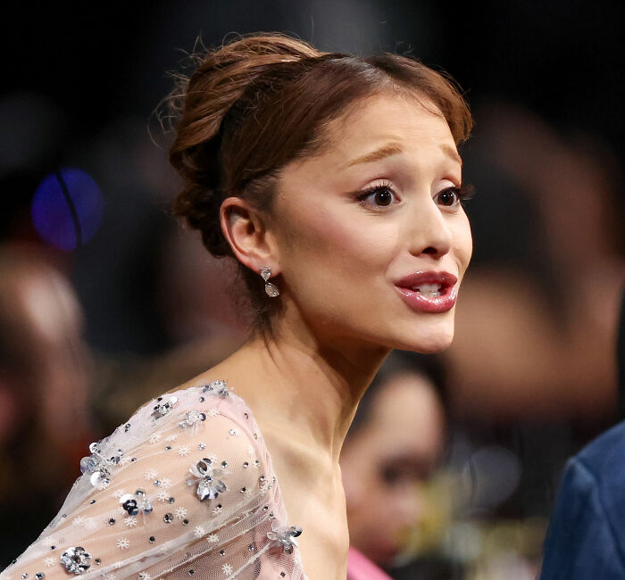 Ariana Grande displaying bizarre mannerisms during a recent interview, sparking numerous unsettling theories.