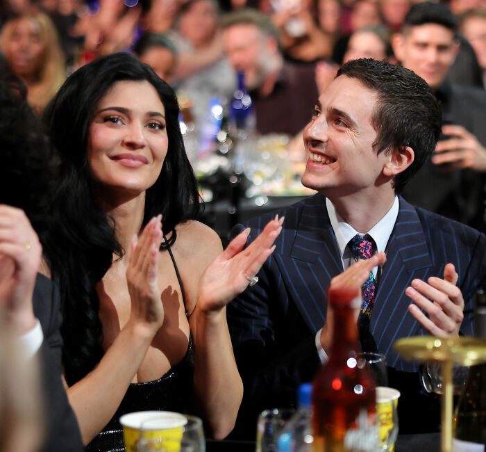 Timothée Chalamet and Kylie Jenner clapping at an event, fans pointing out sad detail about their moment together. Timothée Chalamet and Kylie Jenner clapping at an event, fans pointing out sad detail about their moment together.