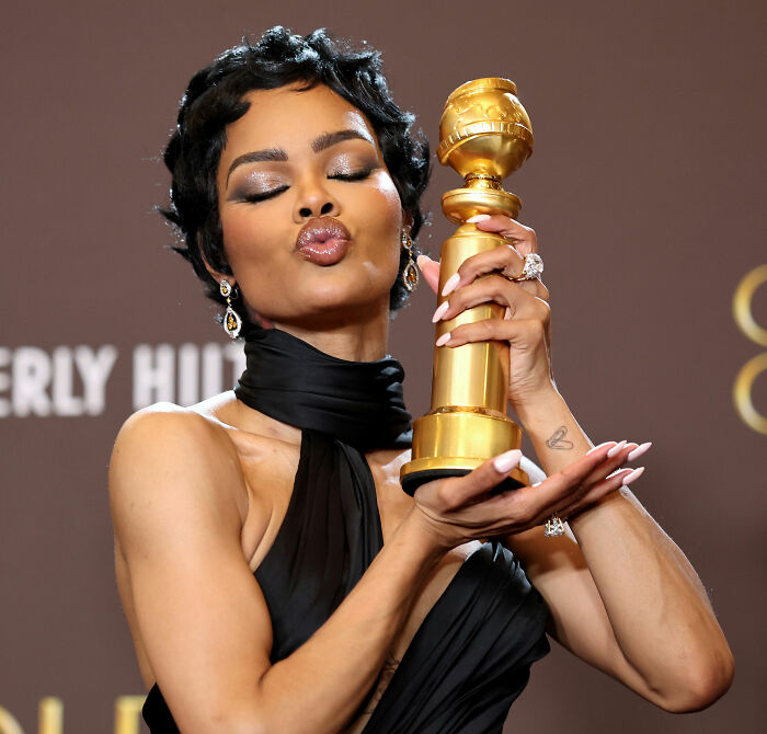 Woman holding a Golden Globe award, celebrating wins as the Academy releases 2026 Oscar nominations event unfolds. Woman holding a Golden Globe award, celebrating wins as the Academy releases 2026 Oscar nominations event unfolds.