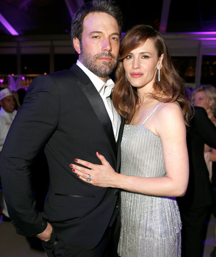 Ben Affleck and Jennifer Garner posing together at an event, highlighting her rare comments about trauma bonding.