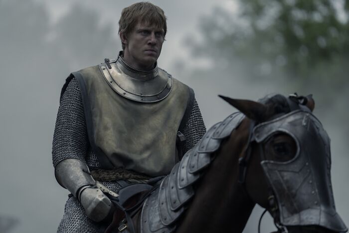 Knight of the Seven Kingdoms in armor riding a horse, representing the timeline in the Game of Thrones universe.