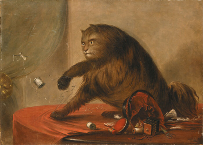 Old painting of a cat knocking over sewing items on a red table, showcasing hilariously bad art with brilliant charm.