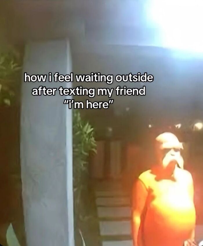 Funny screenshot of a person in a bright costume waiting outside after texting their friend saying they are here.