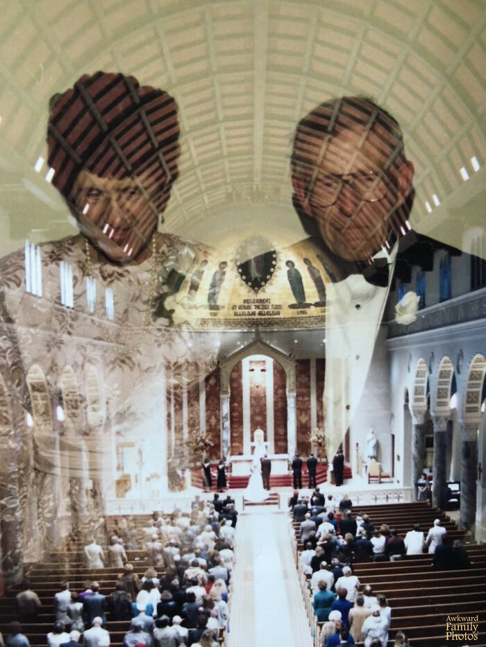Reflection of elderly couple over crowded wedding ceremony inside church, an awkward wedding photo capturing a unique moment.