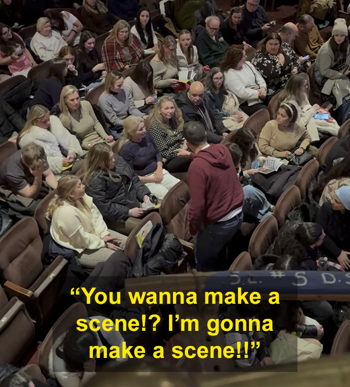 Male Karen confronting audience in crowded Broadway theater during Mamma Mia performance